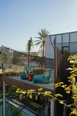 a patio with two vases sitting on a table at Villa Marrakech, Piscine Privée, Sauna et Gym in Marrakech