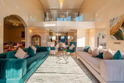 a living room with blue and white couches at Villa Targaït - Luxury villa in Marrakech bliss in Marrakech