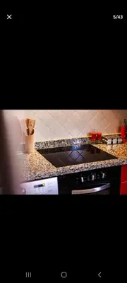 a kitchen with a counter top and a stove at Appartemment Luxe Gueliz in Marrakech