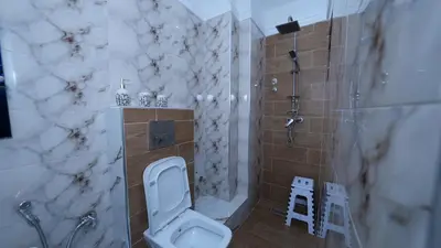 a bathroom with a toilet and a shower at Little dream in Marrakech