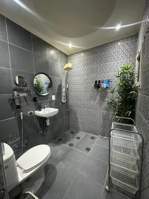 a bathroom with a toilet and a sink at Ryad Lalla khadija in Marrakech