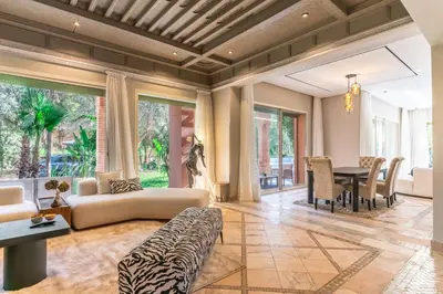 a living room with a couch and a table at Luxurious villa Marrakech La Palmeraie in Marrakech