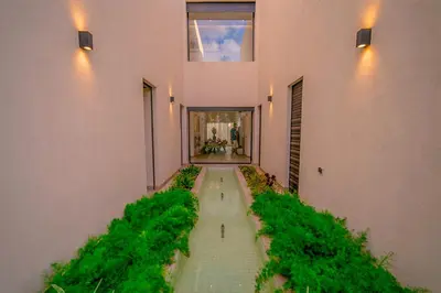 an empty hallway with plants on the side of a building at Villa Lumeria in Marrakech