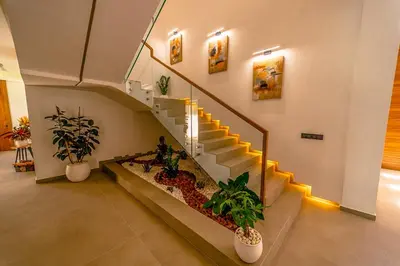 a staircase in a building with potted plants at Villa Lumeria in Marrakech