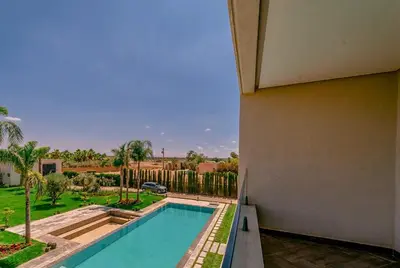 a view of a swimming pool from a house at Villa Lumeria in Marrakech