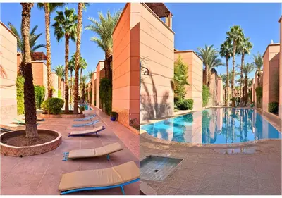 a resort with a swimming pool and palm trees at Luxury Riad Marrakech - 3BR - Rooftop - Jacuzzi in Marrakech