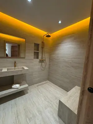 a bathroom with a sink and a mirror at Refined Apartment in Guéliz Laya Home Luxury in Marrakech