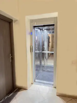 an open door to a room with a glass at Cozy Apt Close to Gueliz & Medina in Marrakech
