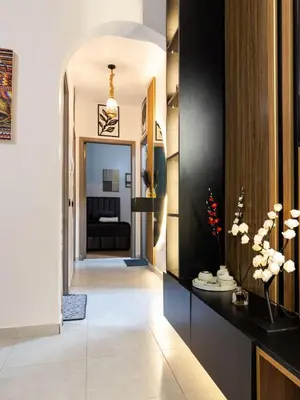 a hallway of a hotel with a black and white lobby at Cozy Apt Close to Gueliz & Medina in Marrakech