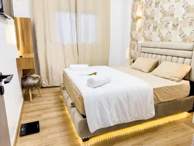 a bedroom with a bed with two towels on it at Cozy Apt Close to Gueliz & Medina in Marrakech