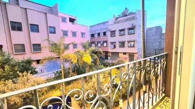 a view of a city from a balcony at Cycas Family Apart grand wifi parking in Marrakech
