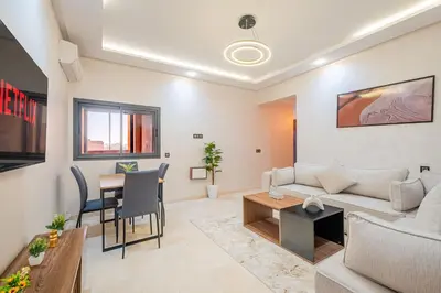 a living room with a couch and a table at New! Modern 2BR Guéliz Center, Station & M-Avenue in Marrakech