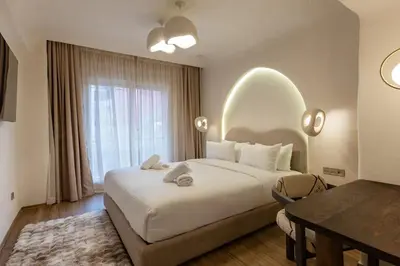 a hotel room with a large bed and a window at Cosy escape 1BED in central Gueliz With Pool in Marrakech