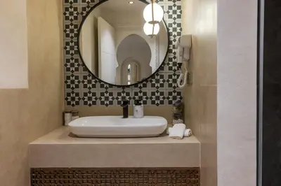 a bathroom with a sink and a mirror at Cosy escape 1BED in central Gueliz With Pool in Marrakech