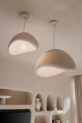 two lights hanging from the ceiling of a kitchen at City Center 1 BED Apartments - Miramas - Pool and gym in Marrakech