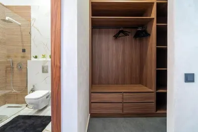 a bathroom with a closet with a toilet and a shower at Luxury Villa Hammam Piscine chauffeé sans Vis Avis in El Harkat