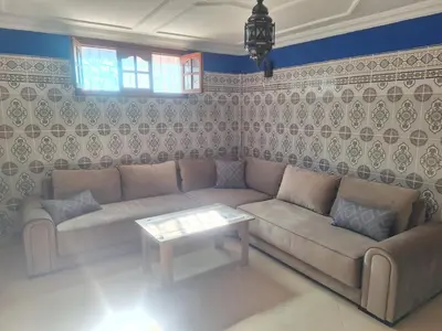a living room with a couch and a table at charming place in Marrakech