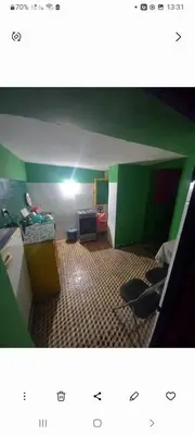 a room with a green and white walls and a room with at Madam Laila house in Marrakesh in Marrakech