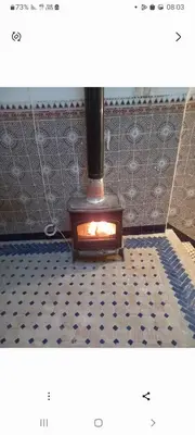 a stove in a room with a tiled floor at Madam Laila house in Marrakesh in Marrakech