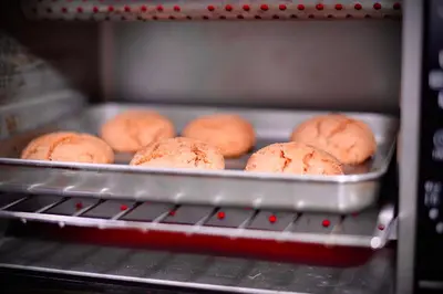 a tray of donuts sitting in an oven at Riad Dar Ceramic in Marrakech