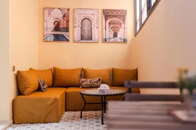 a living room with a couch and a table at Karim Miloudi in Marrakech