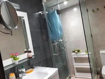 a bathroom with a shower and a sink and a mirror at Rosa High standing apartment in Marrakech