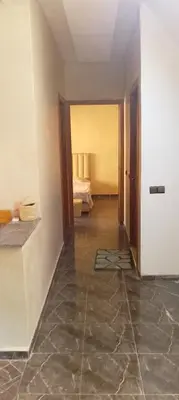 an empty room with a room with a bed in it at Belkadi in Marrakech