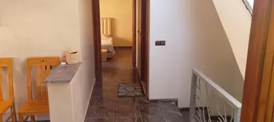 a hallway with a stairway leading to a room at Belkadi in Marrakech