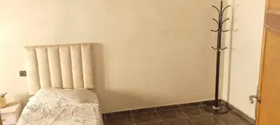 a room with a radiator and a bed in it at Belkadi in Marrakech