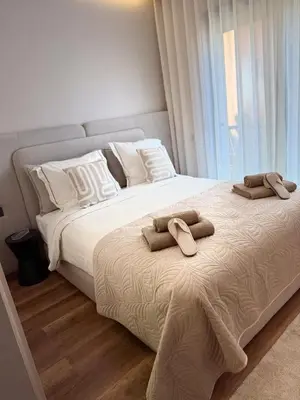 a bedroom with a large bed with two towels on it at Appartement moderne en plein Gueliz in Marrakech