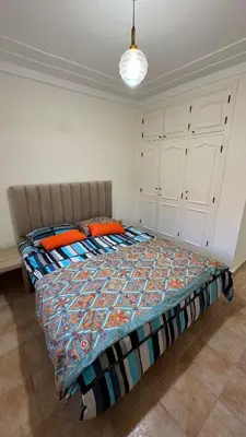 a bedroom with a bed in a room at Appartement 2 chambres et 1 salon récemment rénové in Marrakech