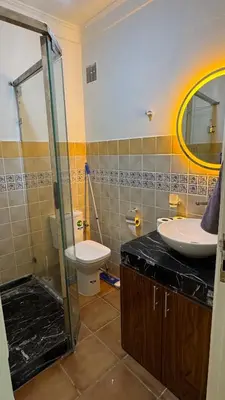 a bathroom with a sink and a toilet at Appartement 2 chambres et 1 salon récemment rénové in Marrakech