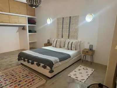a bedroom with a bed in a room at Villa Bellisa in Marrakech