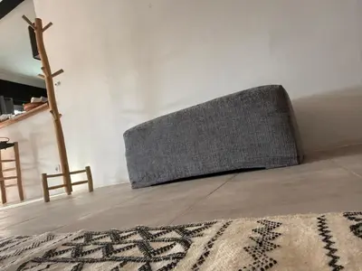 a couch sitting on the floor in a room at Villa Lalla et Moulay in Marrakech