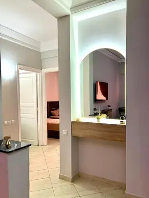 a bathroom with a sink and a mirror at Appartement allal el fassi in Marrakech