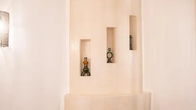 a wall with three different objects on it at Riad Lalla Sofia à 200m des tombeaux Saadiens in Marrakech