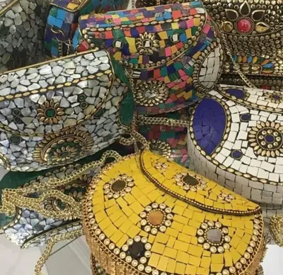 a pile of mosaic purses andbags on display at Riad El yacout in Marrakech