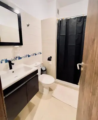 a bathroom with a toilet and a sink and a shower at Marrakech Menara in Marrakech