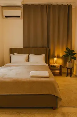 a bedroom with a large bed with a window at Marrakech Menara in Marrakech