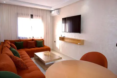 a living room with a couch and a table at Abir37 in Marrakech