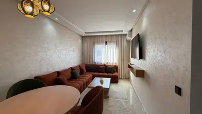 a living room with a couch and a table at Abir37 in Marrakech