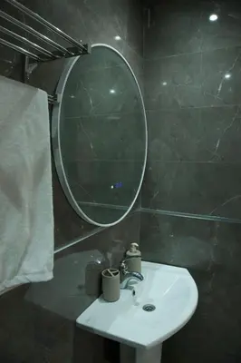 a bathroom with a sink and a mirror at Abir37 in Marrakech