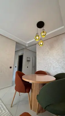 a dining room with a table and chairs at Abir37 in Marrakech