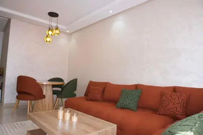 a living room with a couch and a table at Abir37 in Marrakech