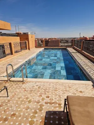 a swimming pool on the roof of a building at Exceptional duplex apartment in Guéliz with Jacuzzi in Marrakech