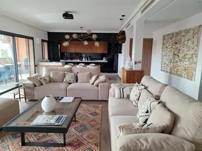 a living room with two couches and a coffee table at Exceptional duplex apartment in Guéliz with Jacuzzi in Marrakech