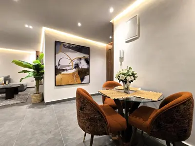 a dining room with a table and chairs at Central New 1BR Next to the Train Station in Marrakech