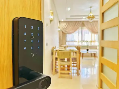 a remote control in front of a living room at Appartement Marrakech-GOLDEN OASIS in Marrakech