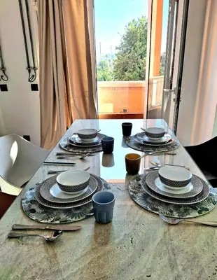 a table with plates and dishes on top of it at Central Atlas View in Marrakech