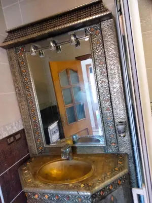 a bathroom with a sink and a mirror at Babylon 1